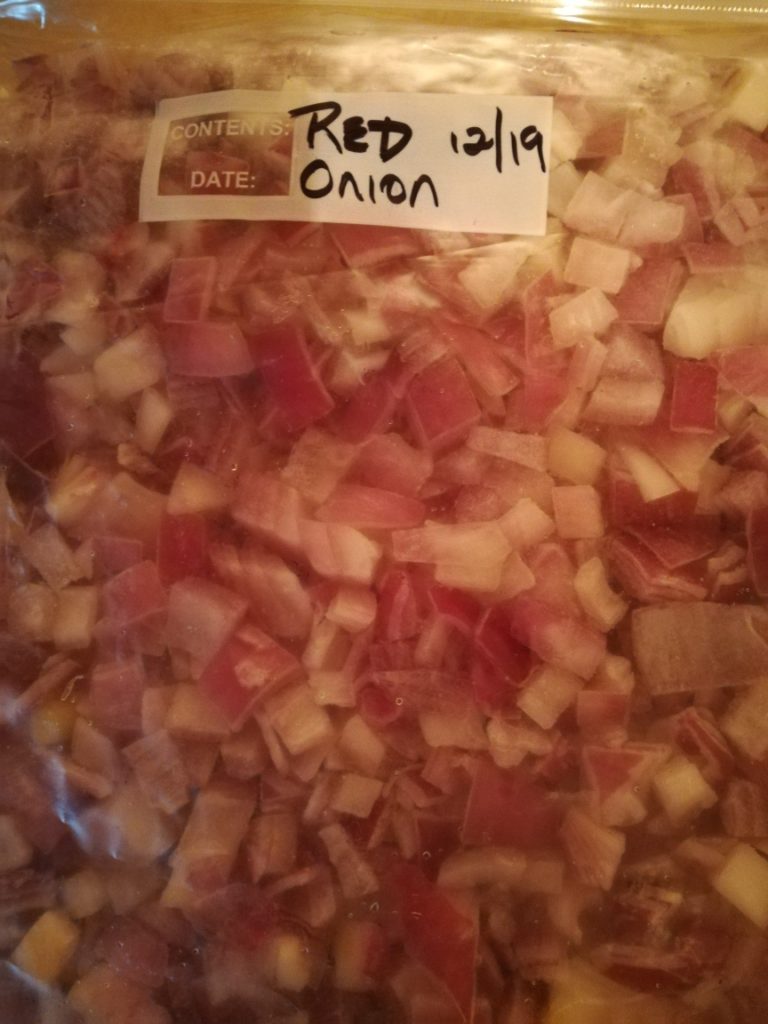 Red onions in a freezer bag