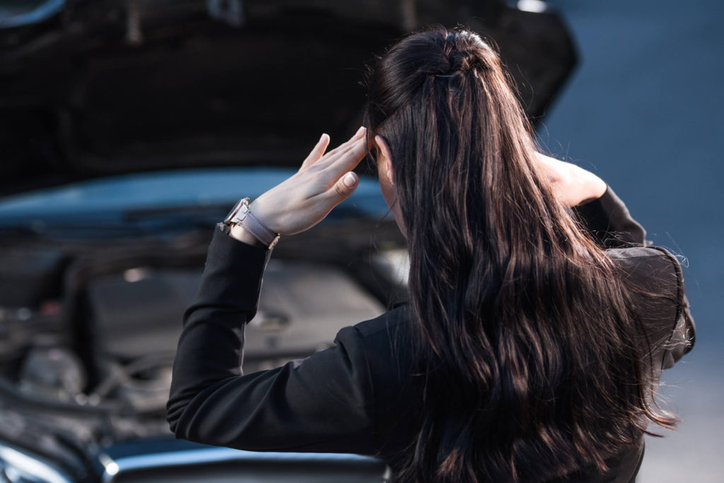 woman with car that has broken down